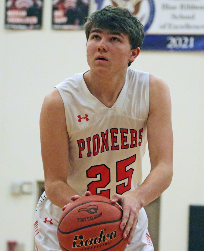 Pioneers senior Landon Miller eyes the basket on a free-throw attempt Tuesday at Fort Calhoun High School.