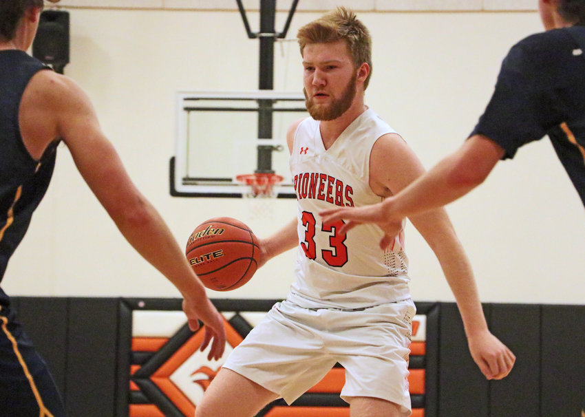 Pioneers senior Carsen Schwarz dribbles against Brownell-Talbot on Tuesday at Fort Calhoun High School.