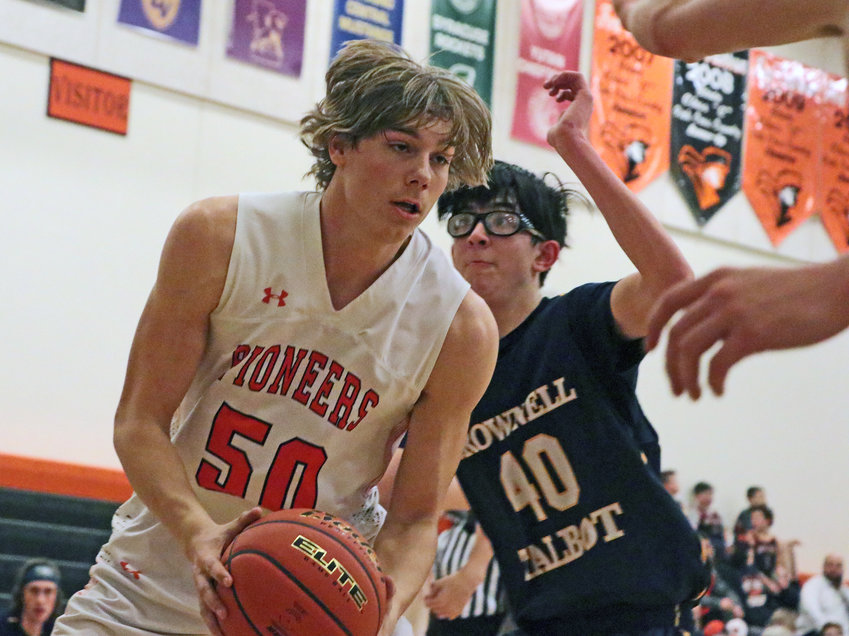Pioneer Wyatt Appel, left, hauls in an inside pass as Brownell-Talbot's Simon Lim defends Tuesday at Fort Calhoun High School.