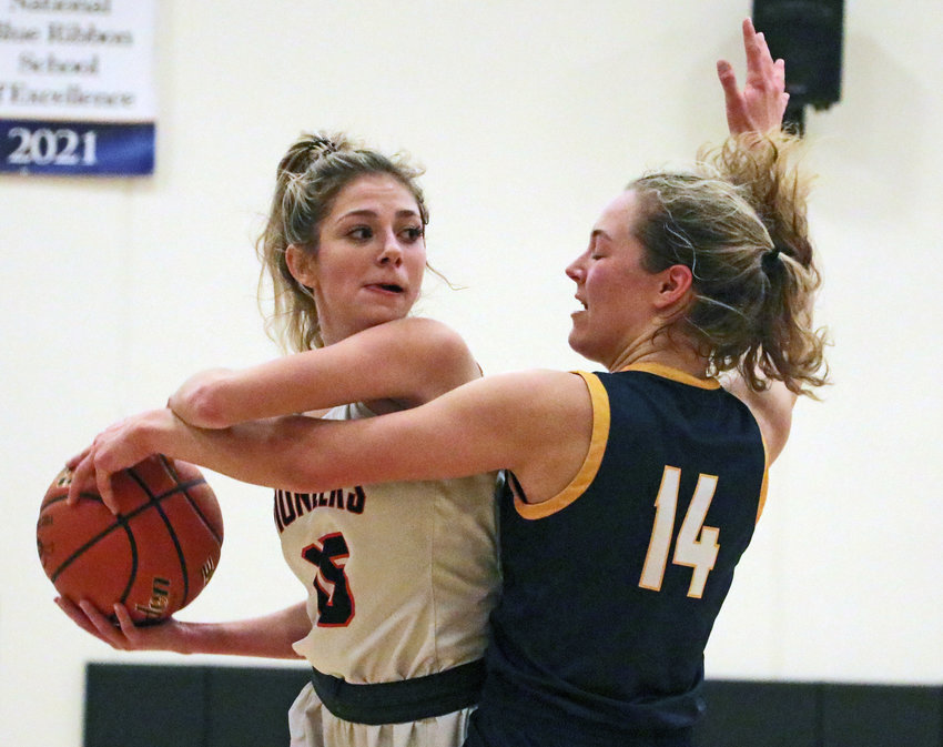 Pioneers senior Tess Skelton, left, keeps the ball from Omaha Brownell-Talbot's Katherine Thaden as halftime approaches Tuesday at Fort Calhoun High School.