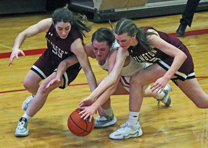 Arlington freshmen Libby Hegemann, left, and Britt Nielsen, right, contend for a loose ball with the Falcons' Keira Murdock on Friday at Douglas County West High School. The next day, the Eagles played the Fort Calhoun Pioneers during the opening round of the Nebrask Capitol Conference Tournament.