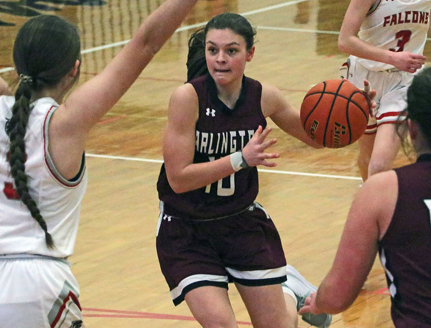 Arlington freshman Hailey O'Daniel, middle, drives into the lane Friday at DC West.