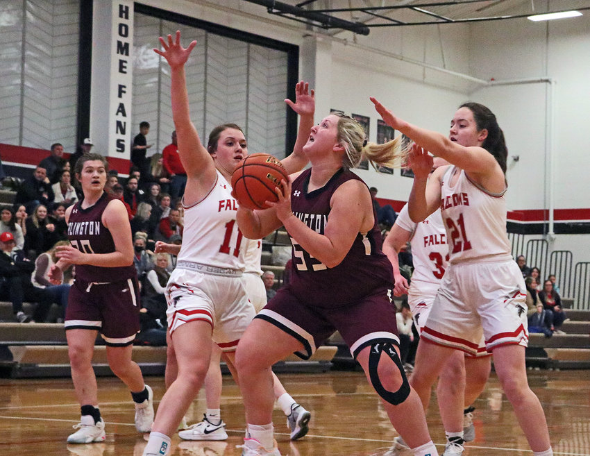 Arlington senior Hailey Brenn, middle, takes a shot in the lane Friday at DC West.