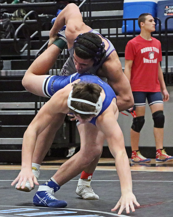 Blair 152-pounder Yoan Camejo, top, trips up Bennington's Layne Boever on Saturday at Elkhorn North.
