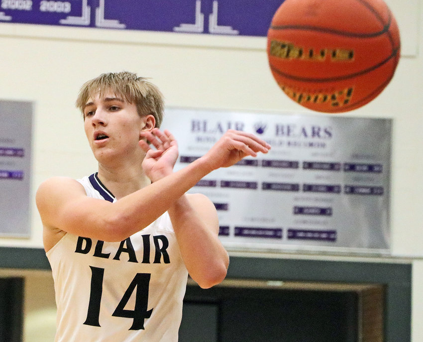 The Bears' Greyson Kay throws a no-look pass Tuesday at Blair High School.