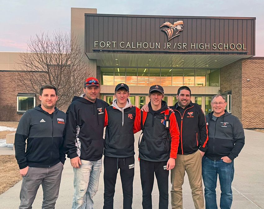 Jake Welchert, from left, Monte Christensen, Ely Olberding, Lance Olberding, Drew Welchert and Jim Meyer pose for a photo Saturday after Ely broke Christensen's school record for career wrestling wins in Wakefield. Olberding, a junior, now has 132 wins competing for his coaches, the Welcherts, after Christensen earned 129 under Meyer in the 1990s.