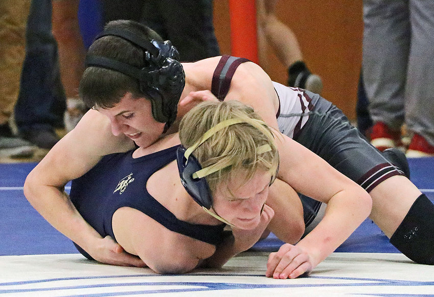 Arlington 113-pounder Trey Hill, top, turns Ethan VanderTop of Lincoln Lutheran on Friday during the Class C District 3 Tournament at Centennial High School. The Eagle pinned his quarterfinals opponent in just 18 seconds.