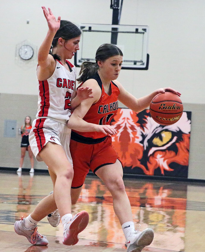 Fort Calhoun guard Maddy Tinkham, right, dribbles while tightly defended by West Point-Beemer's Campbell Knutzen-Snodgrass on Tuesday at North Bend Central.