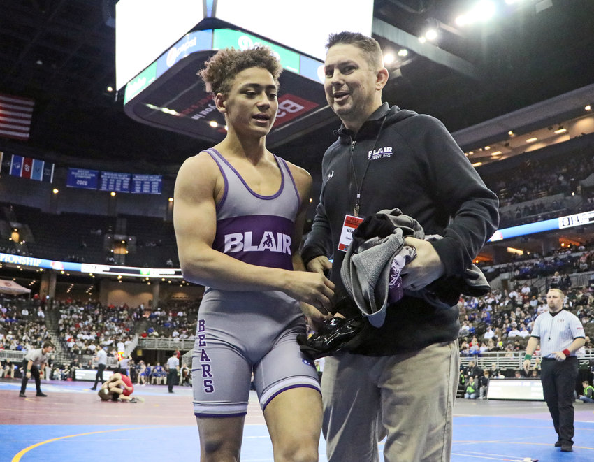 Blair 126-pounder Tyson Brown, left, and coach Erich Warner leave the mat Thursday in Omaha.