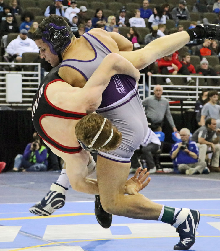 Blair 152-pounder Yoan Camejo, right, scores a takedown against Cozad's Hayden Russman on Thursday in Omaha.