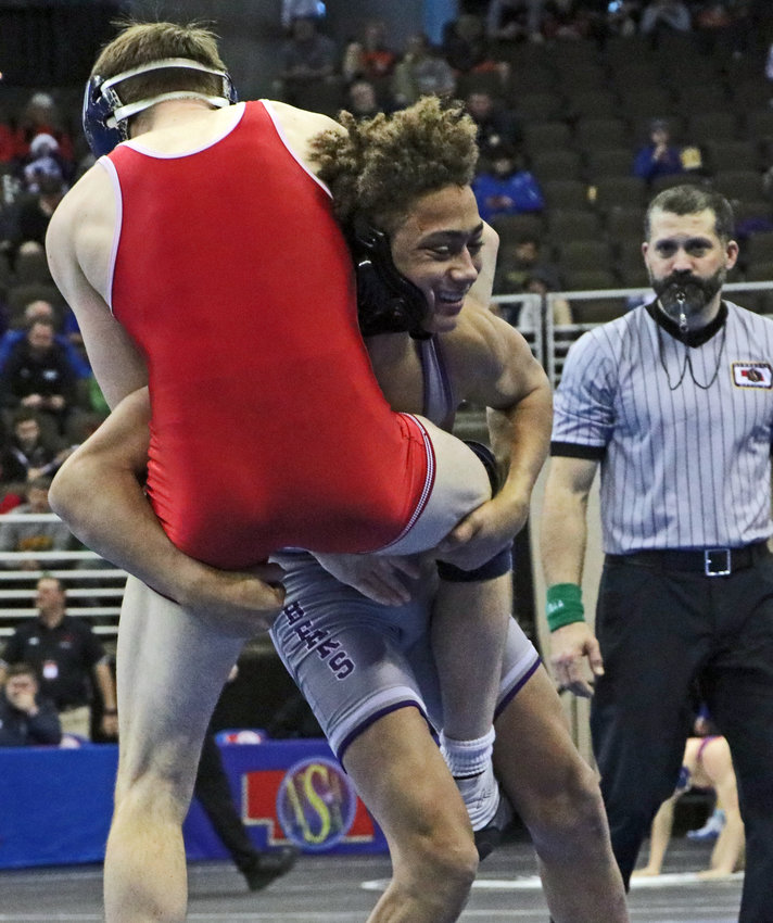 Blair 126-pounder Tyson Brown, right, picks Justin Barbee of Adams Central up off of the mat Friday in Omaha.