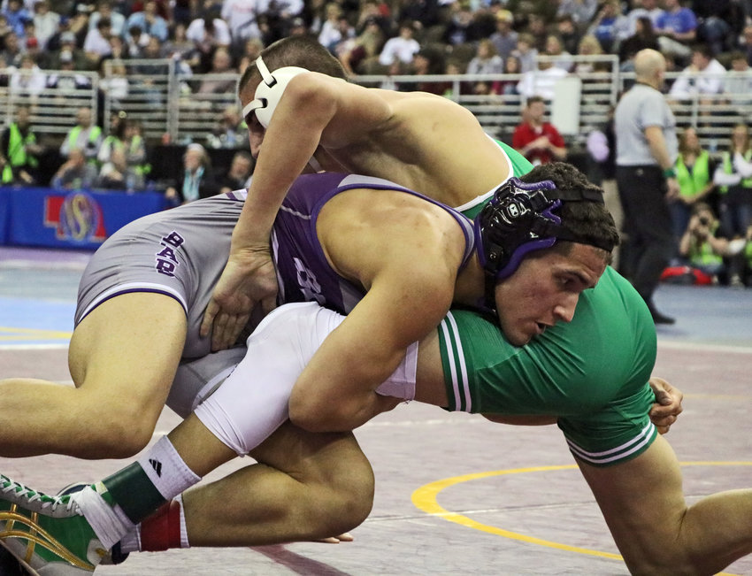 Blair 152-pounder Yoan Camejo, left, works for a takedown against Omaha Skutt's Cade Ziola on Friday at the CHI Health Center.