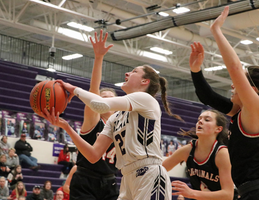 Bears freshman Addie Sullivan, middle, drives to the basket against South Sioux City on Wednesday during the Class B Subdistrict 4 Tournament final at Blair High School. The Bears beat the Cardinals and are just one more win away from earning a state tourney spot.