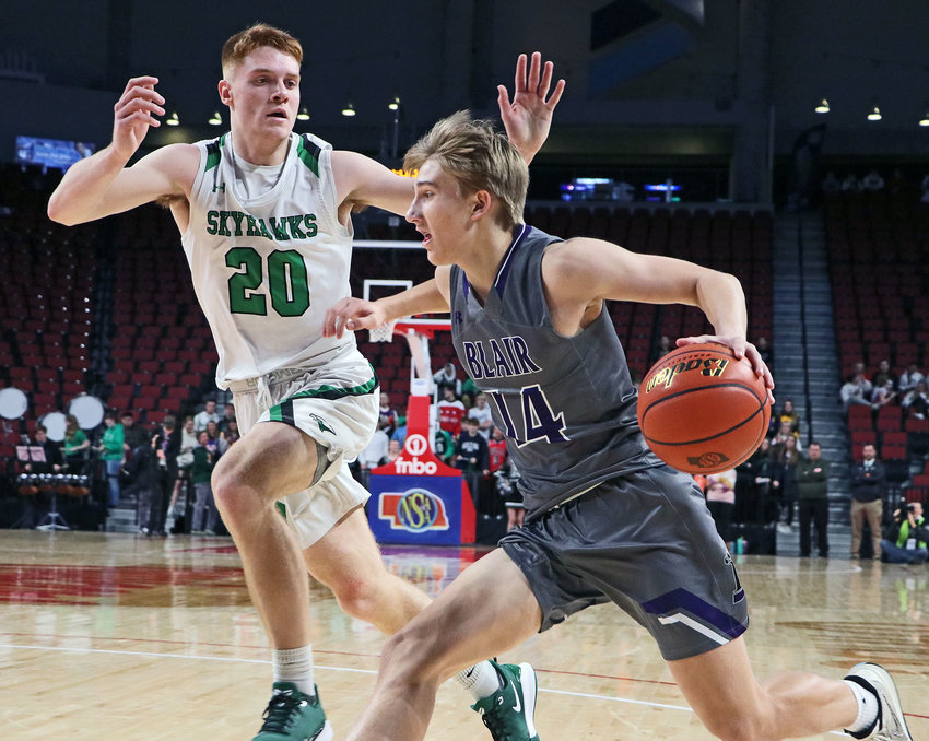 Blair junior Greyson Kay, right, dribbles while defended by Omaha Skutt's Grant Dvorak on Monday at Pinnacle Bank Arena in Lincoln.