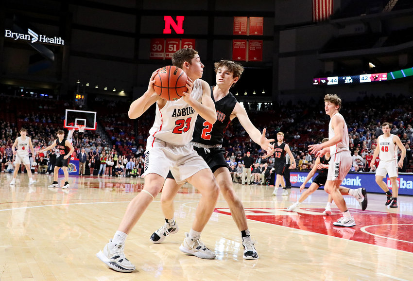 Fort Calhoun senior Owen Newbold, middle right, guards Auburn's Marcus Buitrago on Thursday at Pinnacle Bank Arena in Lincoln.