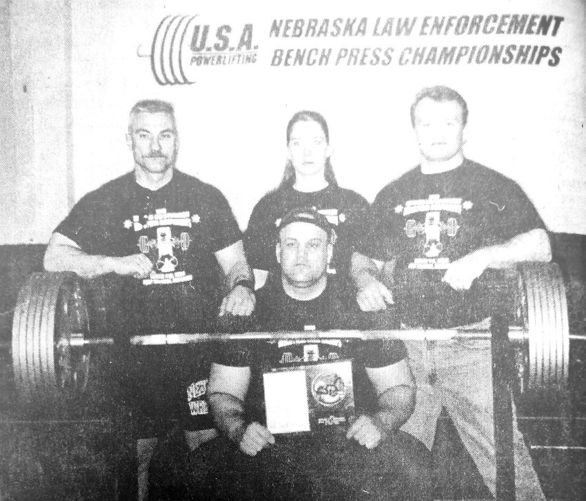 Washington County representation in the 2000 Nebraska Law Enforcement Bench Press Championships poses for a photo. They are Tom Lamb, front row, and Ben Scherer, back row from left, Brenda Anderson and Tim Anderson.