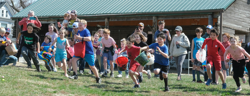 Grade school kids dash for eggs Sunday at Camp Fontanelle.