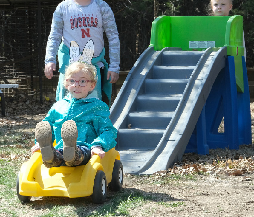 Clair Hansen zooms down the hill at the coaster ride activity at Camp Fontanelle April 10.