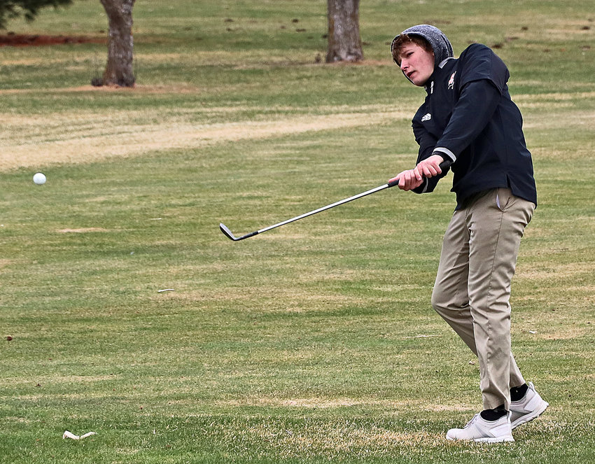 Fort Calhoun's Owen Miller hits his ball onto the green Wednesday at The Pines in Valley.