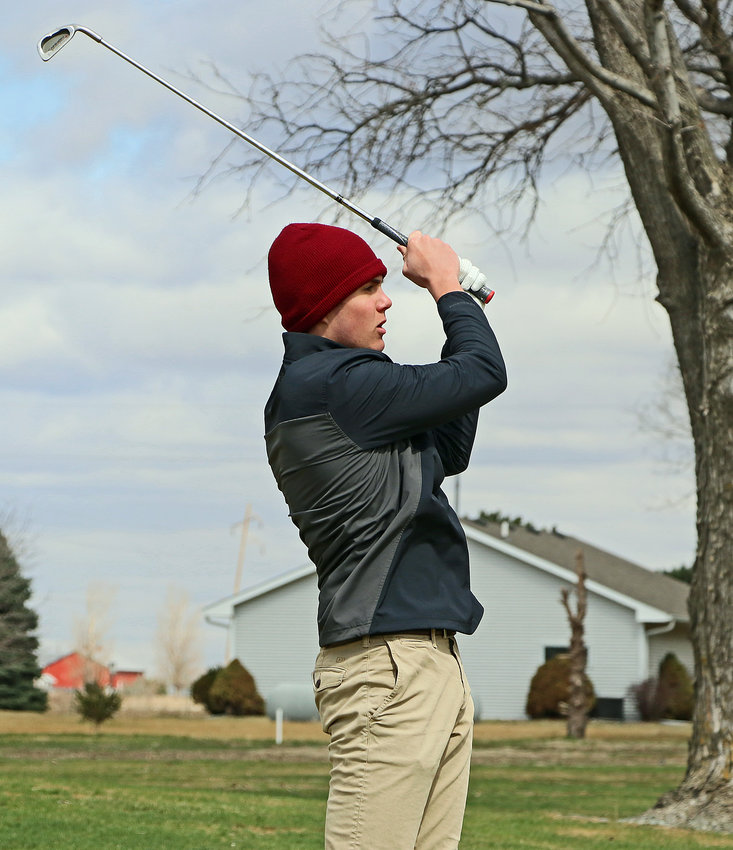 Arlington's Josh Hamre watches his shot down the fairway Wednesday at The Pines in Valley.