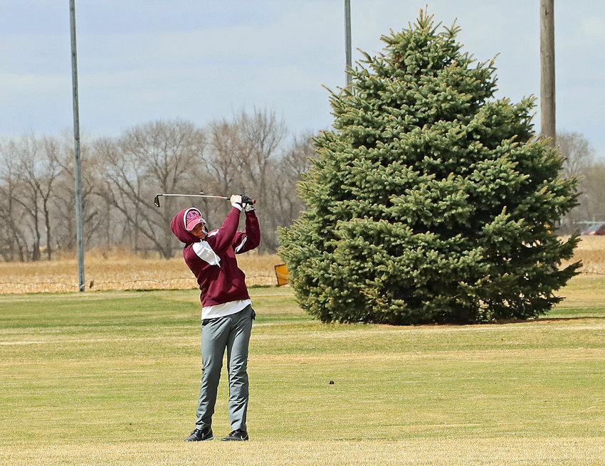 Arlington's Stokely Lewis hits a drive Wednesday at The Pines in Valley.