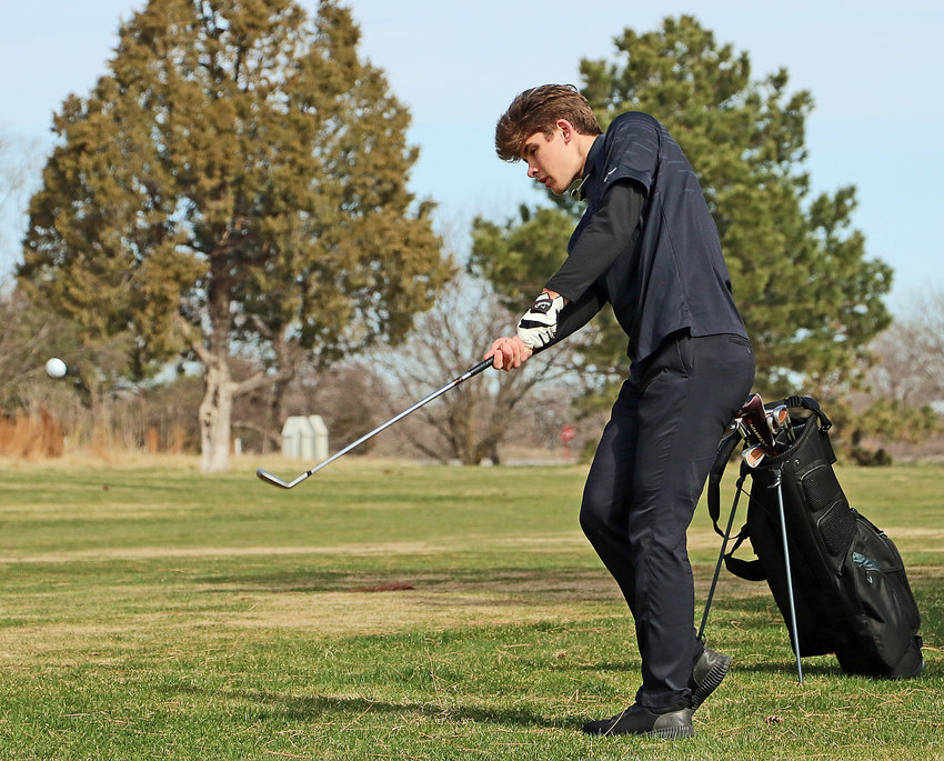 Blair senior Luke Ladwig hits his ball onto the green Monday at Ashland Golf Club.