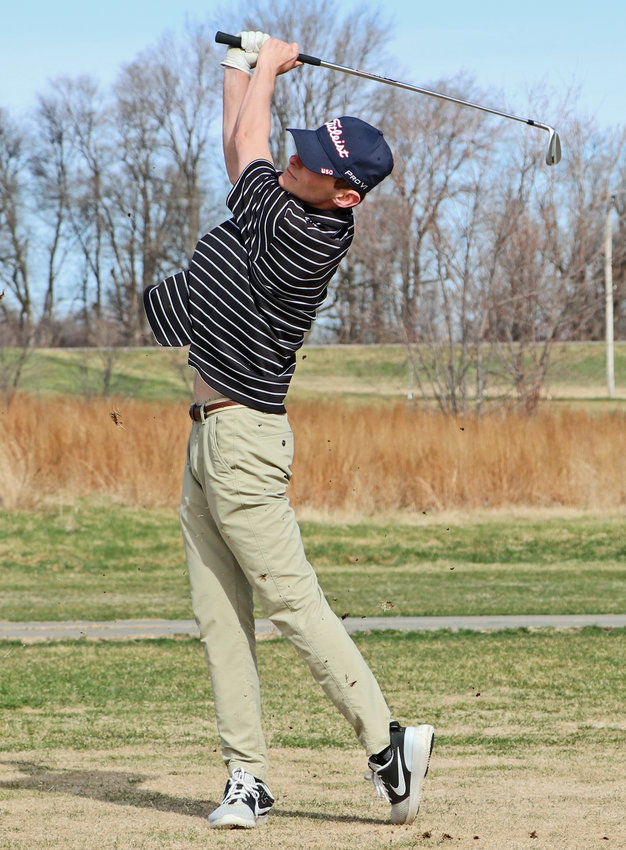 Fort Calhoun senior Owen Newbold follows through on his swing Monday at Ashland Golf Club.