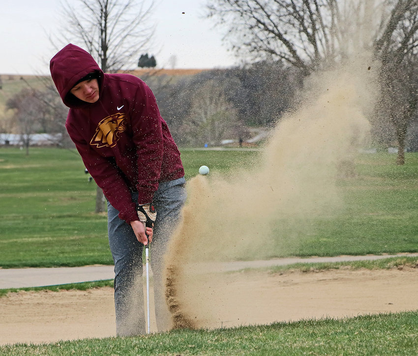 Arlington's Stokely Lewis hits his ball out of the bunker Tuesday at River Wilds Golf Club.