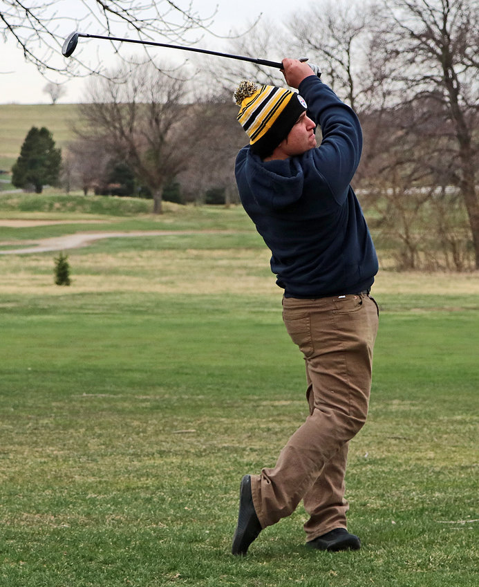 Arlington's Jacob Meehan hits his ball down the fairway Tuesday at River Wilds Golf Club.