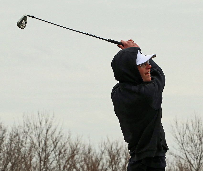 Blair's Adam Grote follows through on his swing Tuesday at River Wilds Golf Club.