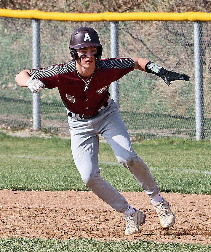 Arlington base runner Dalton Newcomer leads off of first base Friday at the Washington County Fairgrounds.
