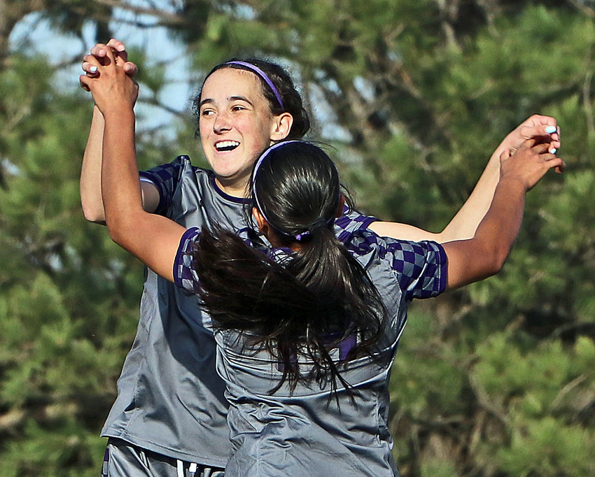Blair's Brynn Ray, facing, celebrates her first-half goal with Allison Hernandez on Tuesday at Krantz Field.