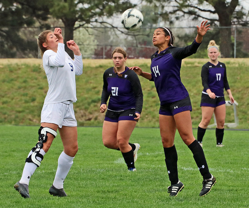 Omaha Concordia's Rianna Greene, left, and Blair's Allison Hernandez, front right, contend for the soccer ball as the Bears' Wrylee Osterhaus, back left, and Madeline Dirkschneider watch the play unfold Saturday at Krantz Field.