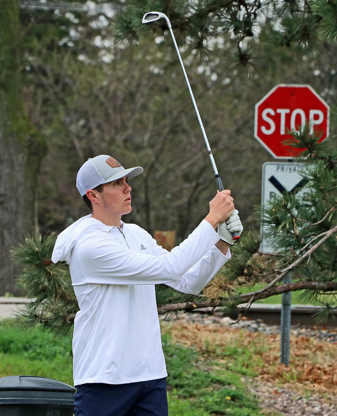 Arlington's Josh Hamre watches his tee shot Friday at Fremont Golf Club.