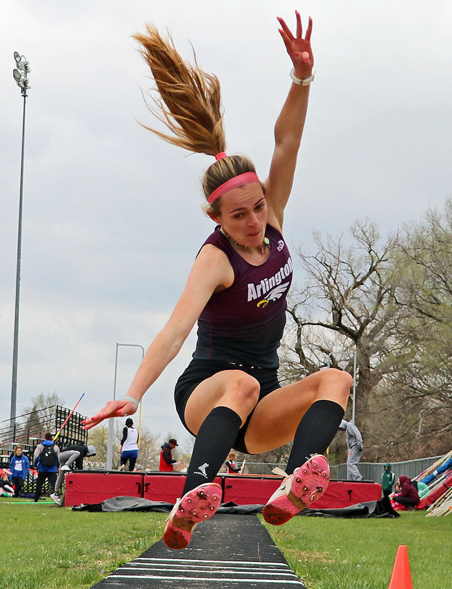 Arlington junior Keelianne Green leaps into the long jump pit Tuesday during the Nebraska Capitol Conference track meet at Yutan High School.