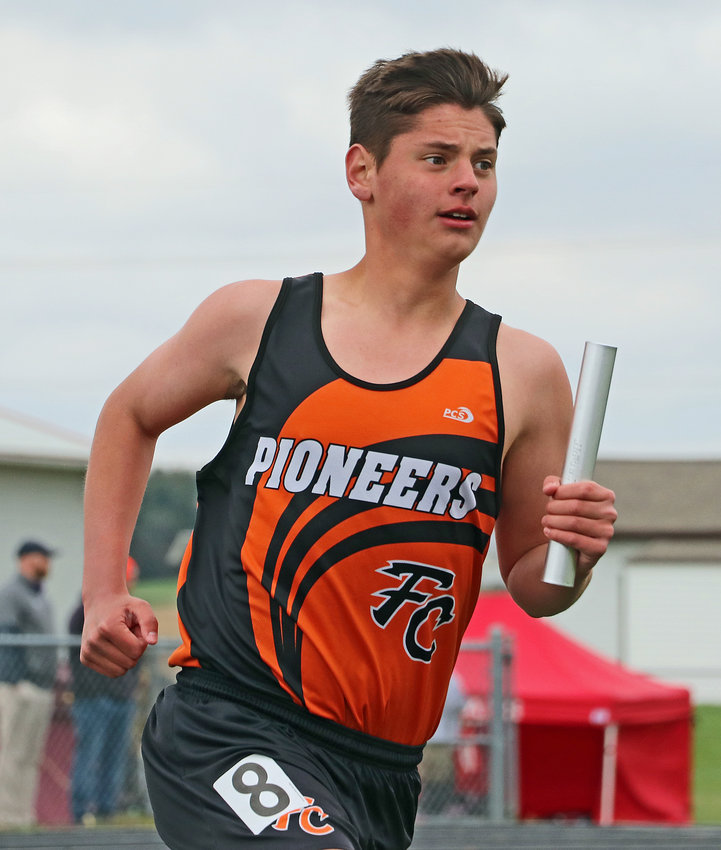 Fort Calhoun's Lawson Tjardes competes in the 3,200-meter relay Tuesday at Yutan High School.