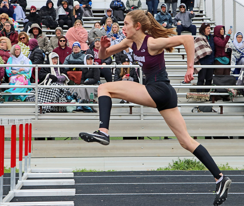 Arlington senior Kailynn Gubbels hits the midpoint of her 100-meter hurdles race Tuesday at Yutan High School.