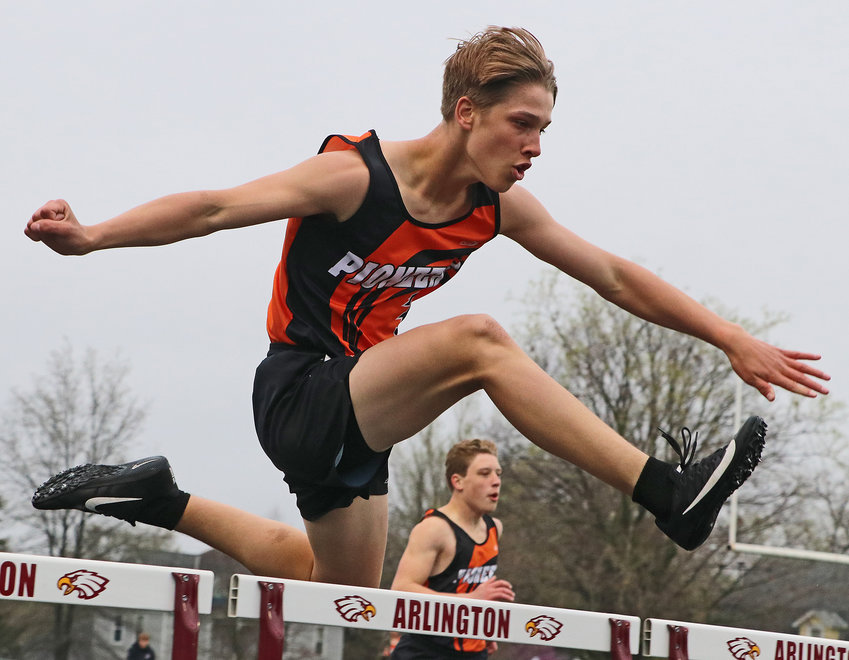 Fort Calhoun's Tyler DeMilt, front, competes in the 300-meter hurdles alongside teammate Alex Schuler on Thursday at Arlington High School.