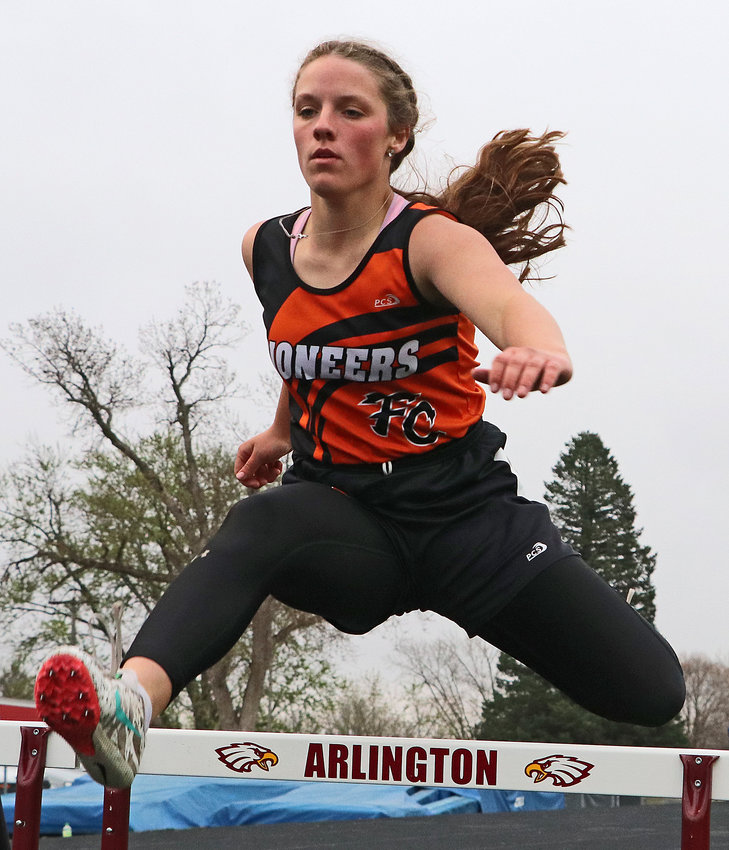 Fort Calhoun's Anna Taylor clears a hurdle Thursday at Arlington High School.