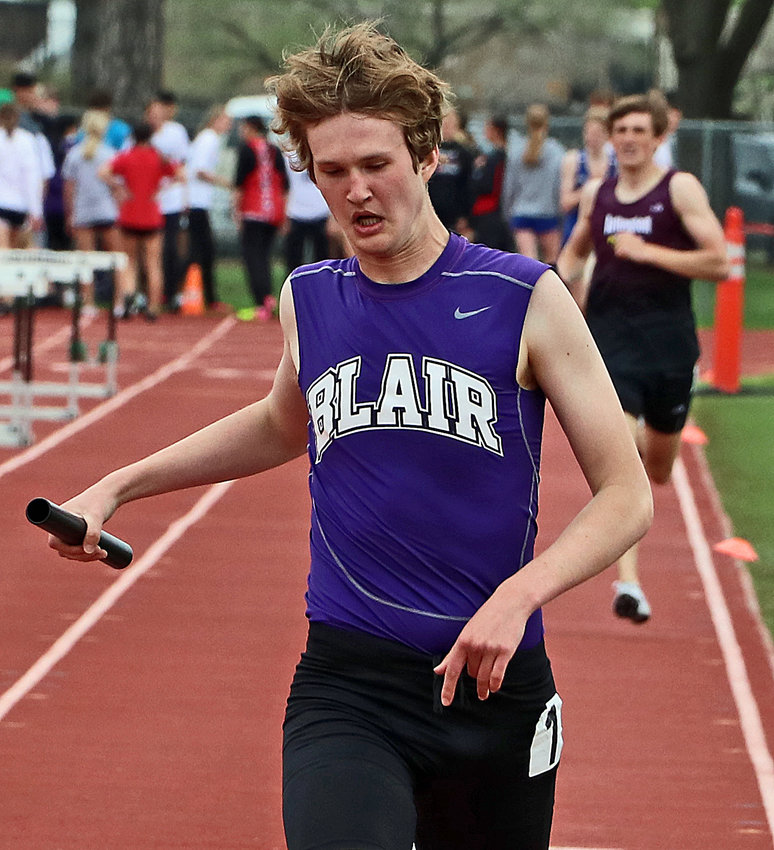 Blair's Caleb Funk finishes a relay race Tuesday in Columbus.