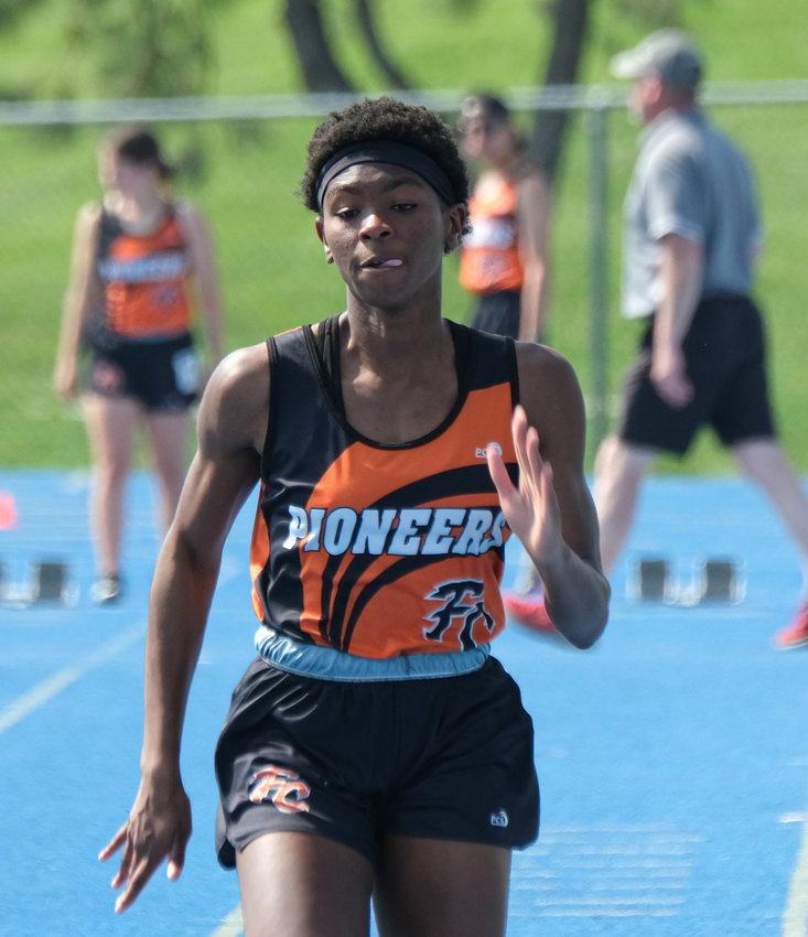 Fort Calhoun junior Dala Drowne sprints the 100-meter dash Tuesday at Wahoo High School.