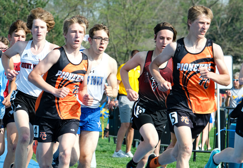 The Olberding brothers run the 3,200 Tuesday at Wahoo High School.