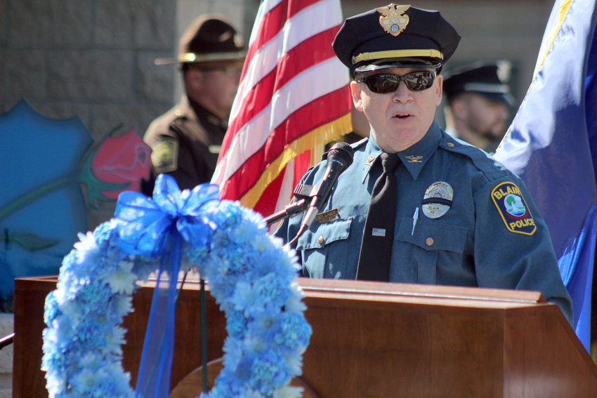 Blair Police Chief Joe Lager gives the welcoming address Saturday morning during the second annual National Peace Officers Memorial Day service at the Washington County Sheriff's Office.