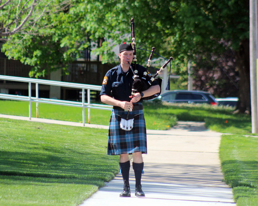 Omaha Police Office Clinton Gormley performs "Amazing Grace" on bagpipes Saturday during the National Peace Officers Memorial Day service.