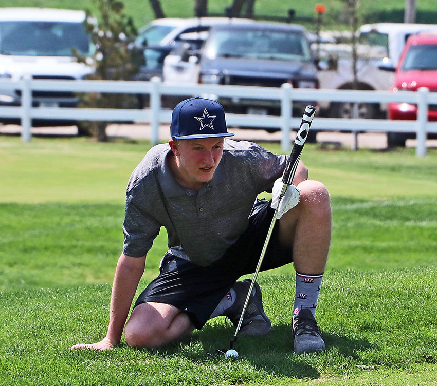 Blair's Sam Hicks reads the grade of the green May 11 at River Wilds Golf Club.