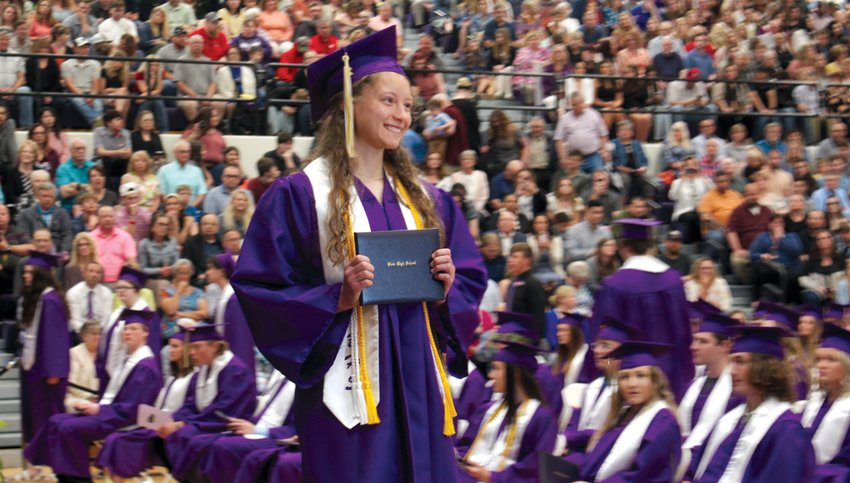 Allie Dingfield smiles with her diploma at Blair High School's Commencement Ceremony on May 15.