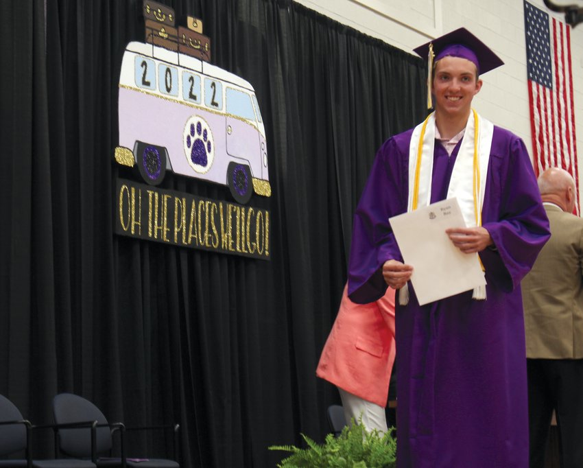 Ryan Ray smiles after receiving his scholarships during the commencement ceremony.