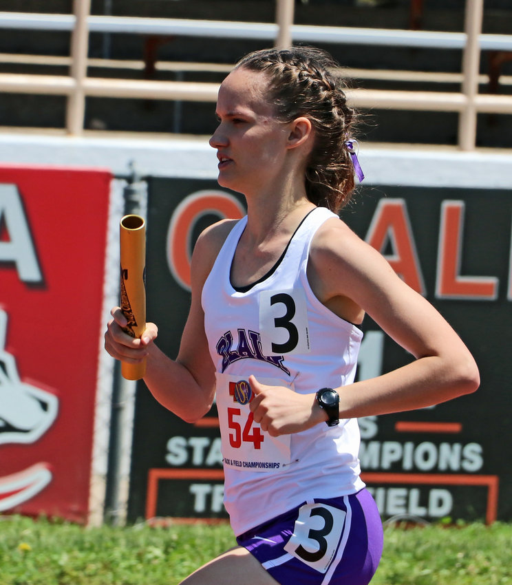 Blair runner Kaitlynn Amandus competes in the 3,200-meter relay Wednesday at Omaha Burke Stadium.