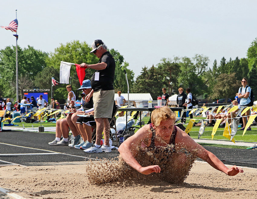 Arlington's Kaden Foust hits the long jump sand Thursday at Omaha Burke Stadium.