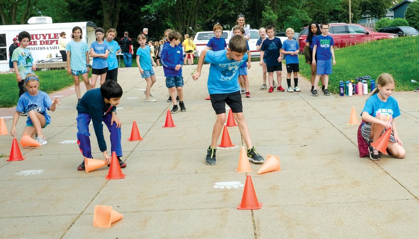 Arbor Park third graders compete in the cone flip relay.